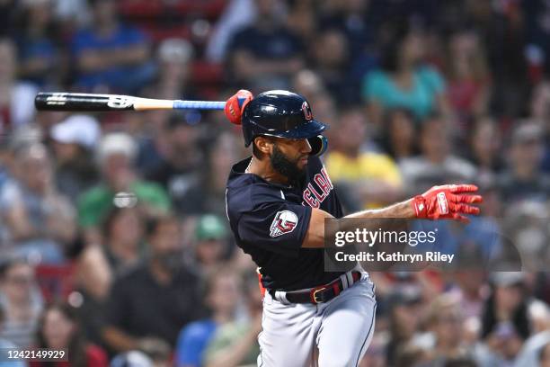 Amed Rosario of the Cleveland Guardians hits a RBI single in the fourth inning against the Boston Red Sox at Fenway Park on July 27, 2022 in Boston,...