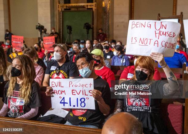 July 27, 2022: Left to right, foreground-Joanna Swan, Gustavo Otzoy, and Annie Powers, members of Street Watch L.A. And the L.A. Tenants Union, show...