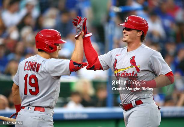 Nolan Gorman of the St. Louis Cardinals celebrates with Tommy Edman after hitting a solo home run in the fifth inning against the Toronto Blue Jays...
