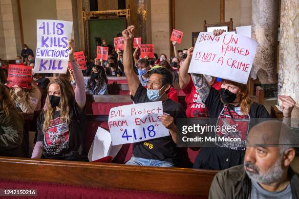 July 27, 2022: Left to right, holding signs-Joanna Swan, Gustavo Otzoy, and Annie Powers, members of Street Watch L.A. And the L.A. Tenants Union,...