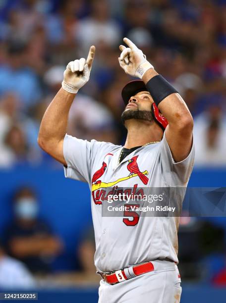Albert Pujols of the St. Louis Cardinals celebrates after hitting a 3 run home run in the fifth inning against the Toronto Blue Jays at Rogers Centre...