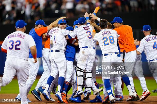 Players and coaches from the New York Mets celebrate after winning the game between the New York Yankees and the New York Mets at Citi Field on...