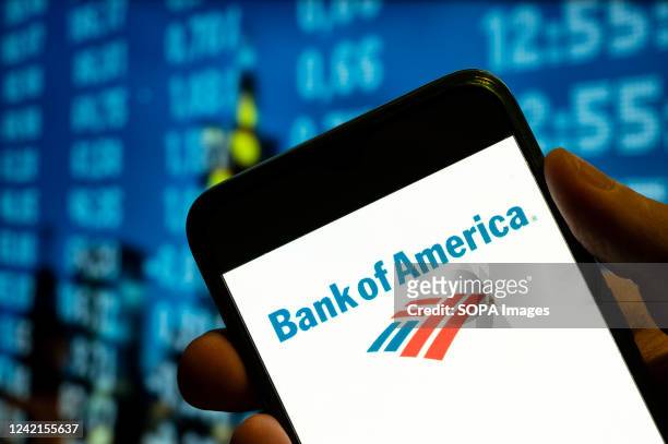 In this photo illustration, the American multinational investment bank and financial services company, The Bank of America , logo is displayed on a...
