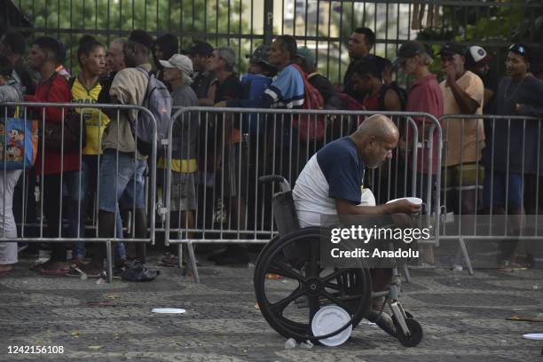 Homeless people receive food aid in Rio de Janeiro, Brazil on July 27, 2022 as the whole world observes the 28th of July World Hepatitis Day....