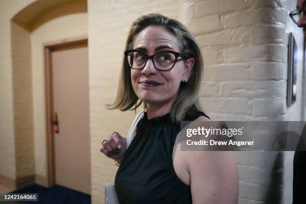 Sen. Kyrsten Sinema walks to a vote at the U.S. Capitol July 28, 2022 in Washington, DC. On Wednesday, Senate Majority Leader Chuck Schumer and Sen....