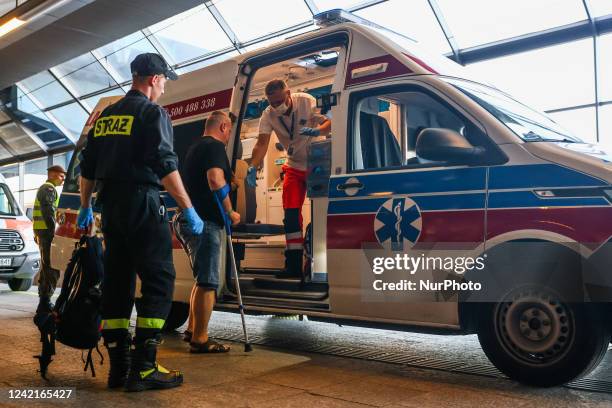 Wounded Ukrainian soldier is entering an ambulance at the main railway station in Krakow, Poland on July 28, 2022. Fifteen wounded soldiers during...