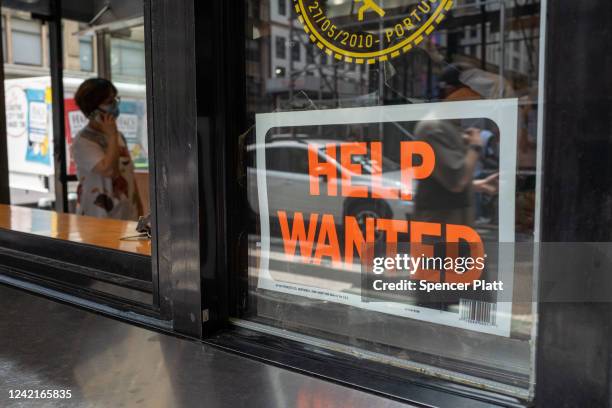 Help wanted" sign is displayed in a window in Manhattan on July 28, 2022 in New York City. The Commerce Department said on Thursday that the nation's...