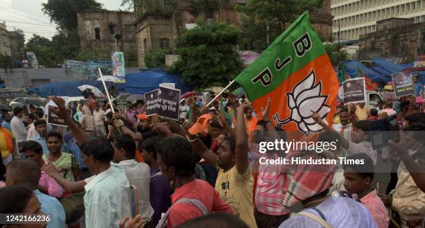 Members protest against Trinamool Congress minister Partha Chatterjee over School Service Commission recruitment scam at Esplanade on July 28, 2022...