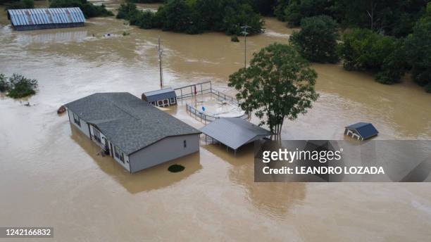 Homes submerged under flood waters from the North Fork of the Kentucky River are seen from a drone in Jackson, Kentucky, on July 28, 2022. At least...