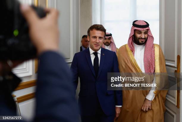France's President Emmanuel Macron arrives with Saudi Crown Prince Mohammed bin Salman for a working dinner at presidential Elysee Palace in Paris on...