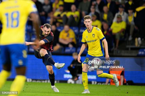 Pogon Szczecin's Michal Kucharczyk kicks the ball past Broendby's midfielder Christian Cappis during the Europa Conference League qualifying football...