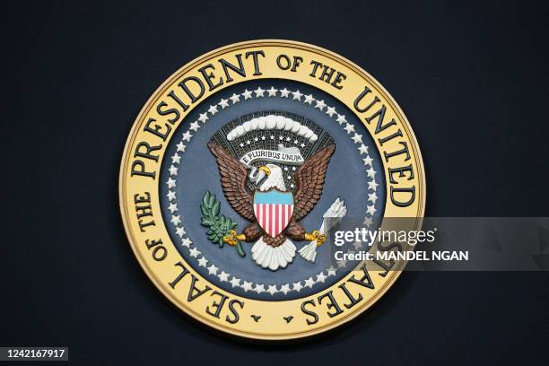 The presidential seal is seen on the lectern ahead of remarks by US President Joe Biden on the Inflation Reduction Act of 2022 in the State Dining...