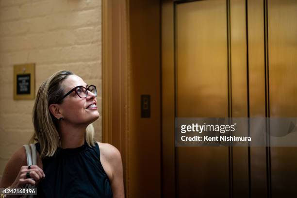 Sen. Kyrsten Sinema walks to a vote at the U.S. Capitol on Thursday, July 28, 2022 in Washington, DC. A day earlier, on Wednesday, Senate Majority...