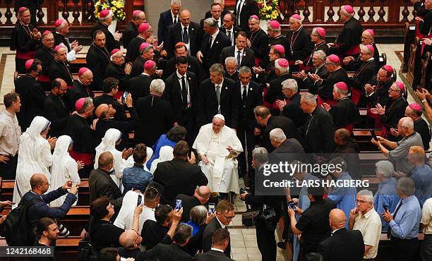 Pope Francis departs after presiding over an evening prayer service at the Basilique-cathedral Notre-Dame in Quebec, Canada, on July 28, 2022. Pope...