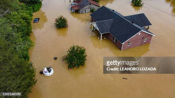 Aerial view of homes submerged under flood waters from the North Fork of the Kentucky River in Jackson, Kentucky, on July 28, 2022. At least eight...