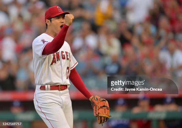 Shohei Ohtani of the Los Angeles Angels reacts after pitching out of a bases loaded jam in the first inning against the Texas Rangers at Angel...