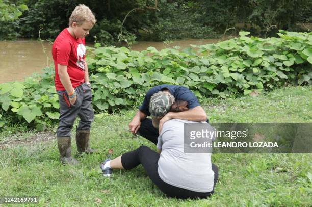 Family anxiously waits to hear about missing family members as a result of the flooding in Jackson, Kentucky, on July 28, 2022. - Flash flooding...
