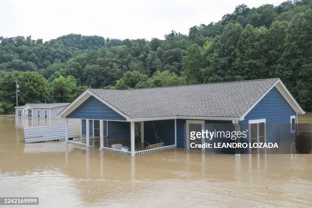 Home is almost completely submerged by floodwaters from the North Fork of the Kentucky River in Jackson, Kentucky on July 28, 2022. Flash flooding...