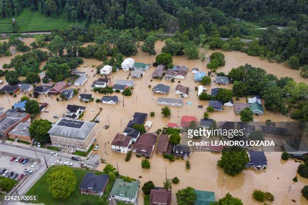 Aerial view of homes submerged under flood waters from the North Fork of the Kentucky River in Jackson, Kentucky, on July 28, 2022. Flash flooding...