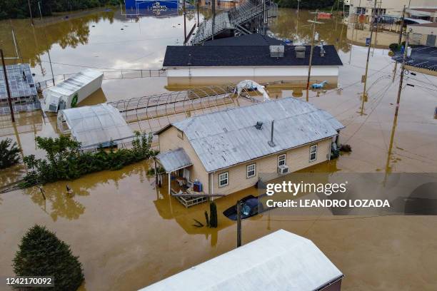 Aerial view of homes submerged under flood waters from the North Fork of the Kentucky River in Jackson, Kentucky, on July 28, 2022. Flash flooding...