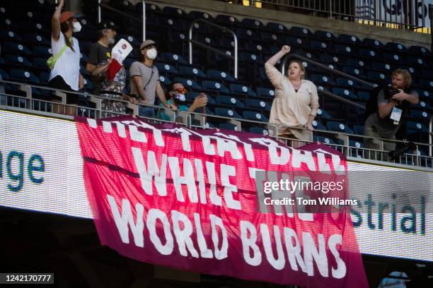 Protesters shout during the Congressional Baseball Game at Nationals Park on Thursday, July 28, 2022.