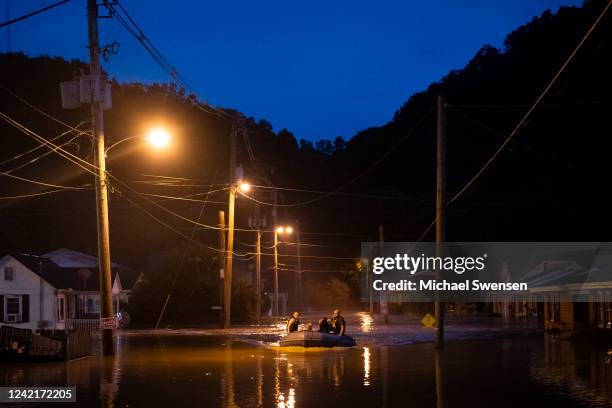 Members of the Jackson Fire Department prepare to conduct search and rescue operations downtown on July 28, 2022 in Jackson, Kentucky. Storms that...