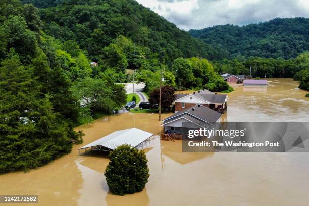 Homes along Gross Loop off of KY-15 are flooded with water from the North Fork of the Kentucky River.
