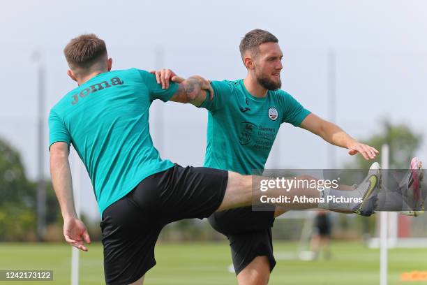 Ryan Manning and Matt Grimes of Swansea City in action during the Swansea City Training Session at The Fairwood Training Ground on July 27, 2022 in...