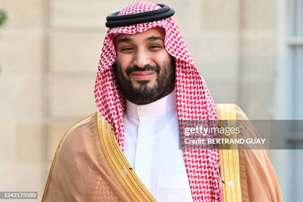Saudi Crown Prince Mohammed bin Salman smiles as he arrives at the Elysee Palace in Paris on July 28, 2022 for a meeting with the French President....