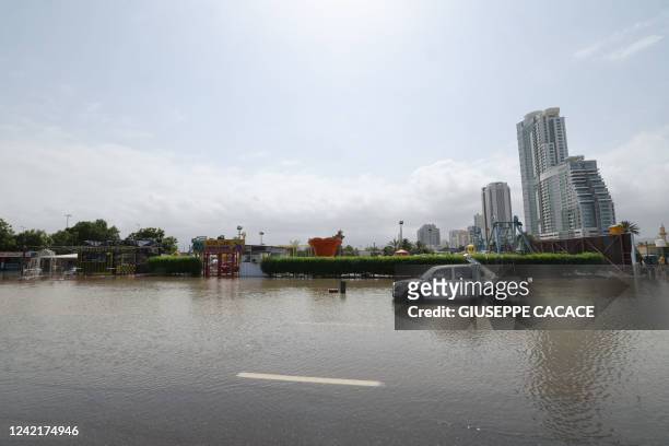 Flooded street is pictured in UAE's Fujairah emirate following heavy rainfall on July 29, 2022.