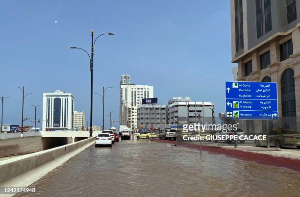 Flooded street is pictured in UAE's Fujairah emirate following heavy rainfall on July 29, 2022.
