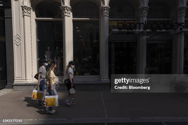 Shoppers carry Aritzia bags past a Bloomingdale's store in the Soho neighborhood of New York, US, on Thursday, July 28, 2022. Consumer spending...