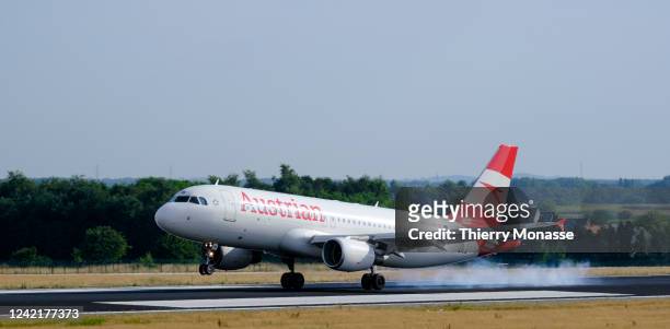 An Airbus A320-214 from Austrian airlines is landing in Brussels Airport on July 29, 2022 in Zaventem, Belgium. Austrian is the national airline of...