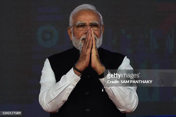 Indian Prime Minister Narendra Modi gestures during the launch of the India International Bullion Exchange and the NSE IFSC-SGX Connect at the GIFT...
