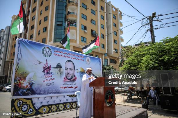 Man speaks in front of the International Committee of the Red Cross building after Palestinians perform the Friday prayer in solidarity with...