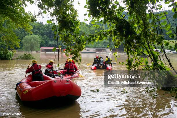 Lexington Firefighters' swift water rescue teams head up overflowed Troublesome Creek to rescue people that have been stranded since Wednesday night...