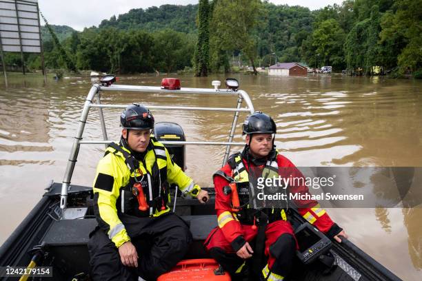 Lexington Firefighters Jeremey Miller and Captain Scott Butler warm up the engine before heading up Troublesome Creek to rescue people that have been...