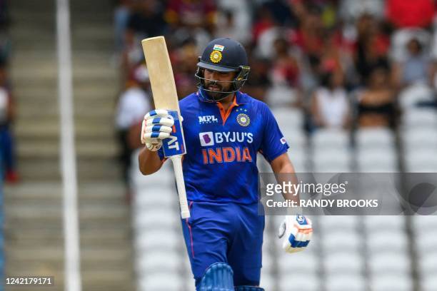 Rohit Sharma of India celebrates his half century during the 1st T20i match between West Indies and India at Brian Lara Cricket Academy in Tarouba,...