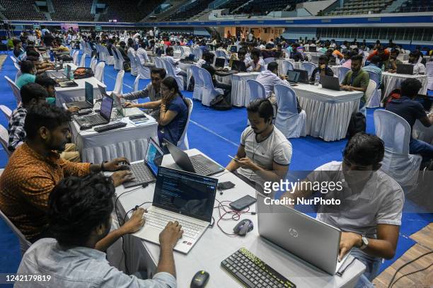 Hackers write codes during an offline hacking competition named Hackathon 2022, in Kolkata on July 29, 2022. The event, the first of its kind in the...