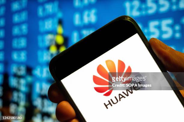 In this photo illustration, the Chinese multinational telecommunications equipment, and consumer electronics company, Huawei logo is displayed on a...