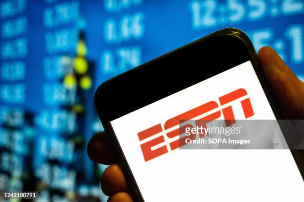 In this photo illustration, the American sports television channel network ESPN logo is displayed on a smartphone screen.