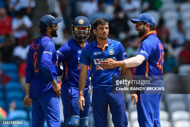 Ravi Bishnoi , Ravindra Jadeja , Rishabh Pant and Rohit Sharma of India celebrate the dismissal of Rovman Powell of West Indies during the 1st T20i...