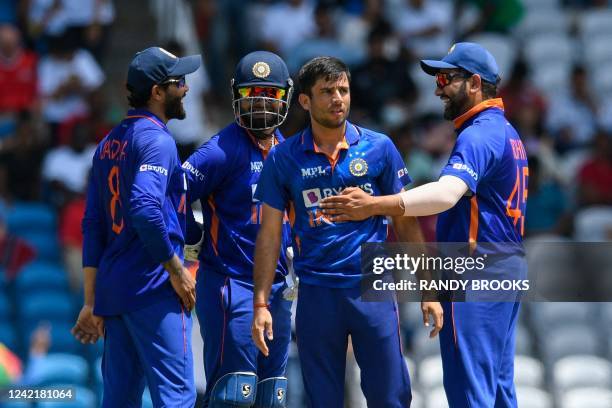 Ravi Bishnoi , Ravindra Jadeja , Rishabh Pant and Rohit Sharma of India celebrate the dismissal of Rovman Powell of West Indies during the 1st T20i...