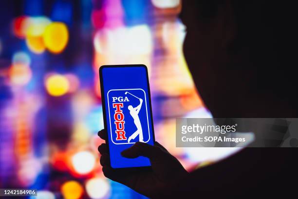 In this photo illustration, the PGA Tour logo is displayed on a smartphone screen.