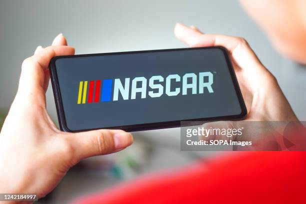 In this photo illustration, the National Association for Stock Car Auto Racing logo is displayed on a smartphone screen.