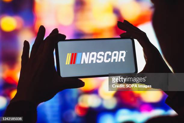 In this photo illustration, the National Association for Stock Car Auto Racing logo is displayed on a smartphone screen.
