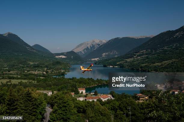 Canadair flies over Lake Barrea, in Barrea on July 27, 2022. The Abruzzo hinterland is known for hosting three important National Parks, namely the...