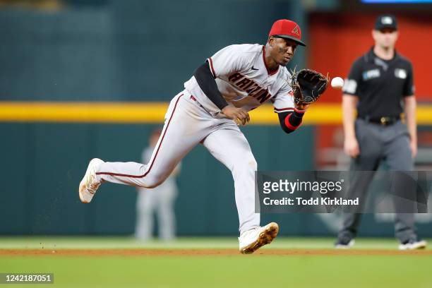 Geraldo Perdomo of the Arizona Diamondbacks fields and throws to first during the seventh inning against the Atlanta Braves at Truist Park on July...