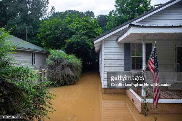 Receding flood waters surround a home in Whitesburg, Kentucky, on Friday, July 29, 2022.
