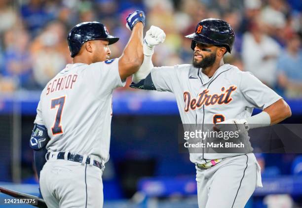 Willi Castro of the Detroit Tigers celebrates his home run with Jonathan Schoop against the Toronto Blue Jays in the sixth inning during their MLB...